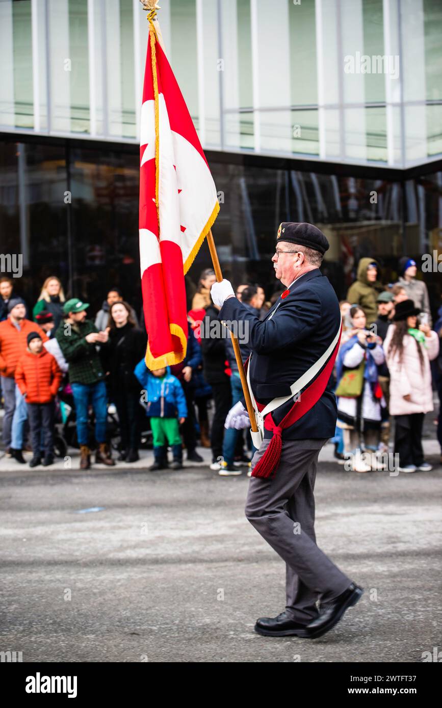 Montreal, Canada - March 17 2024： People celebrating the Saint Patrick`s Day Parade in Montreal downtown Stock Photo